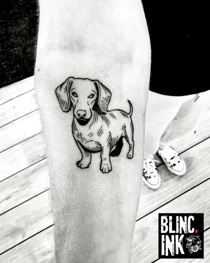 Dachshund: a custom woodcut-style tattoo on the lower arm by Clive Camilleri at Dermoda Studio, Highbridge, Somerset.