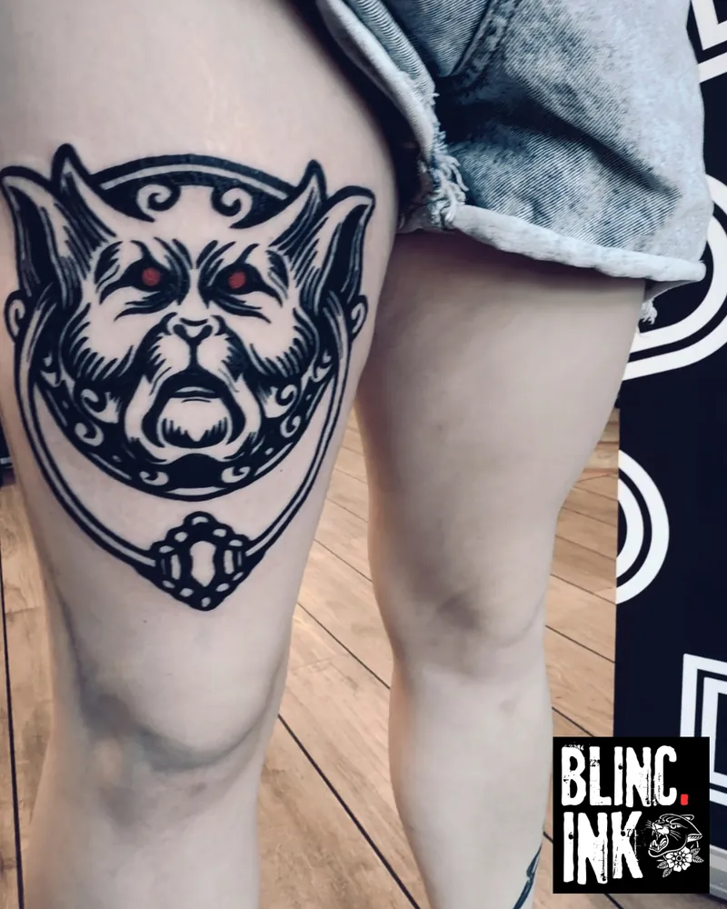 Gargoyle Door Knocker: a custom blackwork-style tattoo on the thigh by Clive Camilleri at Dermoda Studio, Highbridge, Somerset.