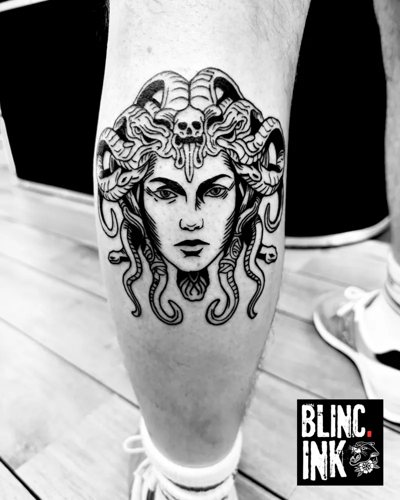 Medusa: a custom engraving-style tattoo on the calf by Clive Camilleri at Dermoda Studio, Highbridge, Somerset.