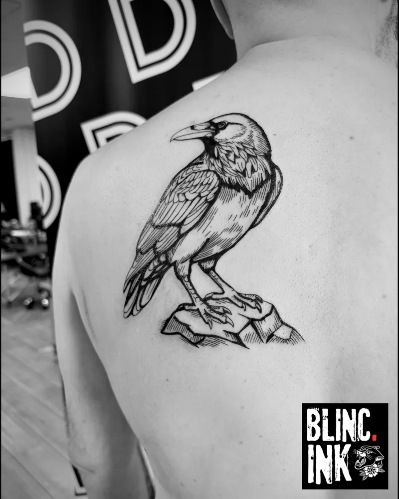Raven: a engraving-style tattoo on the back by Clive Camilleri at Dermoda Studio, Highbridge, Somerset.